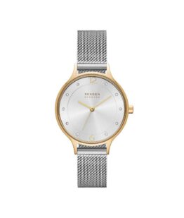 Quartz ur og vandbeskyttet til 3 ATM. Uret har mineral glas, en urkasse i rustfrit stål/gul PVD coating, sølv farvet urskive og mesh lænke i rustfrit stål. Uret måler 30mm i diameter.